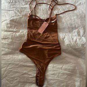 Body suit from miss Lola, never used .